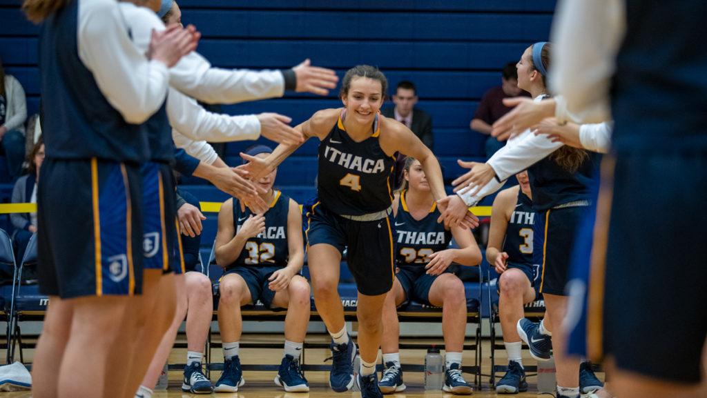 Junior guard Grace Cannon runs through a tunnel of her teammates before a game against Union College on Jan. 24 in Ben Light Gymnasium. 