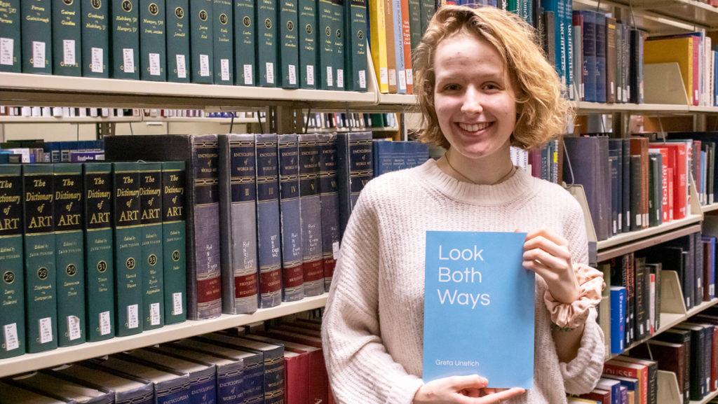 Freshman Greta Unetich poses with her book, Look Both Ways.