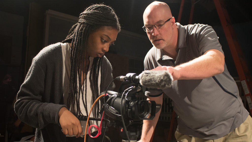 From left, Kalia Kornegay ’18 and James Rada, associate professor and chair of the Department of Journalism, work while producing the documentary “With INFINITE HOPE: MLK and The Civil Rights Movement.”