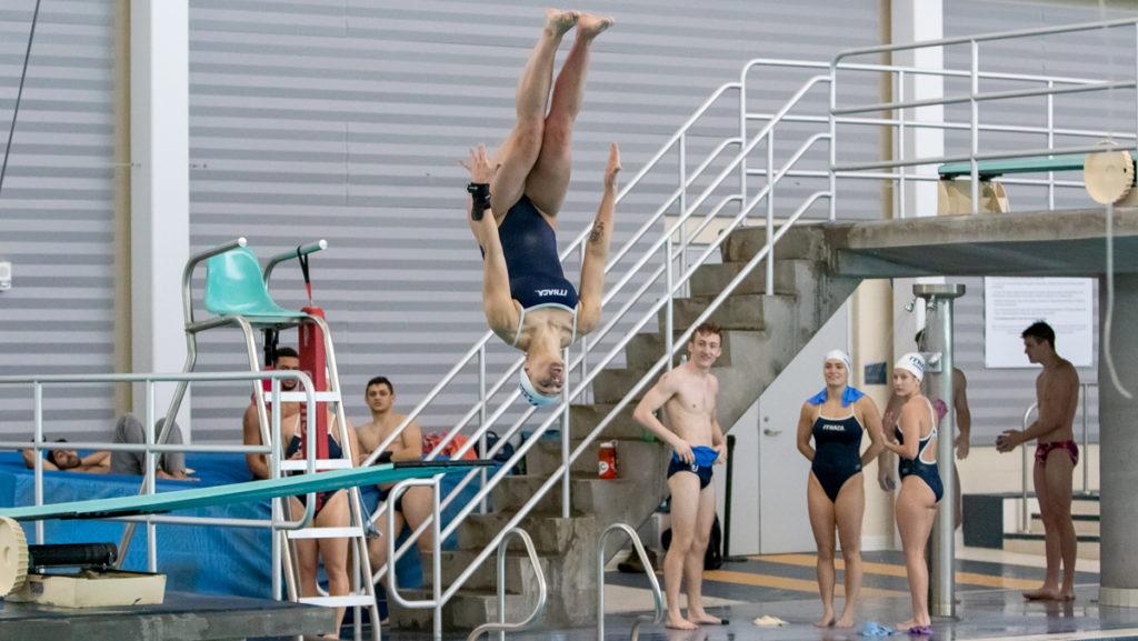 Junior diver Lindsey Duhamel performs a dive off of the 1-meter board during the Ithaca Invitational on Feb. 8 at the Kelsey Partridge Bird Natatorium.