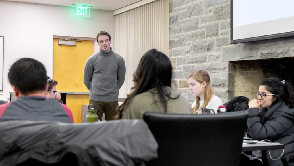 From left, junior Brandon Galione presents about his plans as School of Communications senator to junior Abigail Murtha senate chair of the Student Governance Council (SGC) and senior SGC President Farwa Shakeel. 