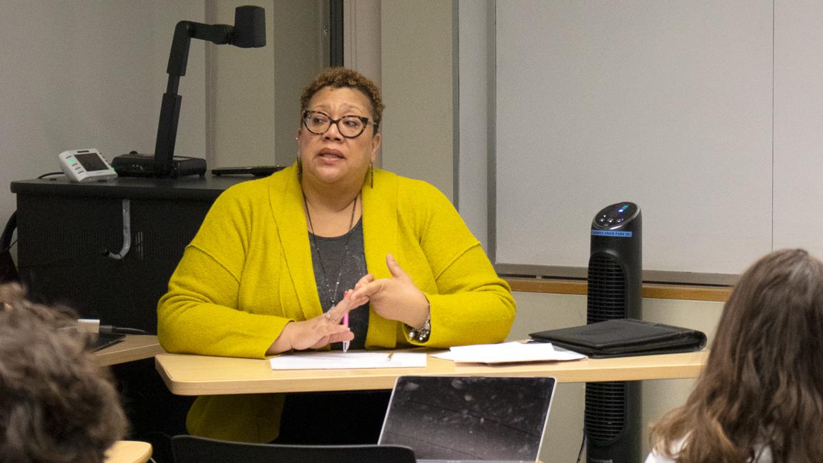 Speaker presents on benefits of diversity in photojournalism