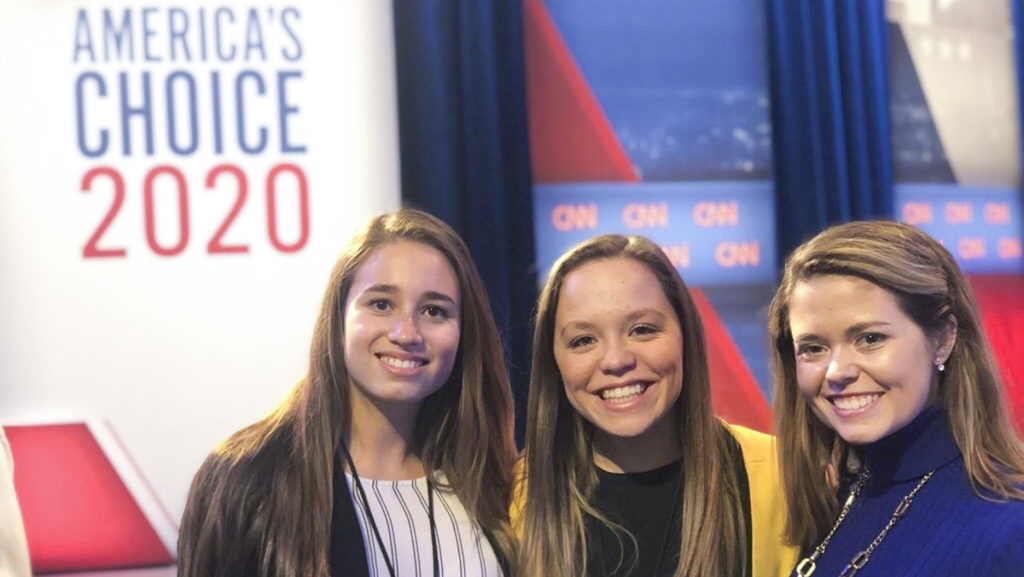 From left, seniors Giulia Villanueva-Lopez and Sarah Horbacewicz, and sophomore Tara Lynch covered the Iowa Caucus on Feb. 3 in Des Moines, Iowa. 