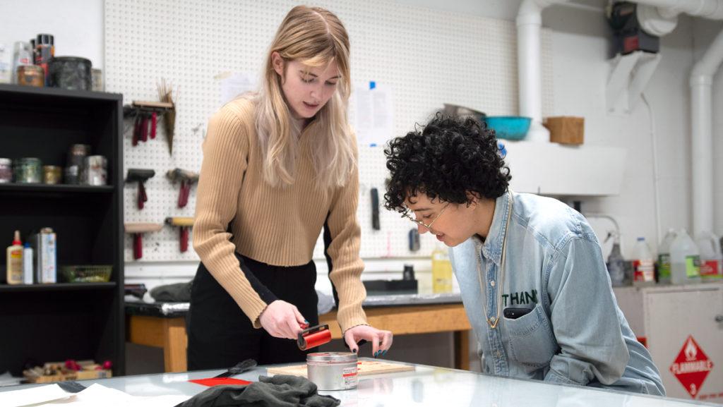 Senior Lily Dickinson works with Paloma Barhaugh-Bordas, assistant professor in the Department of Art, during the Ithaca College Introduction to Print Media class.