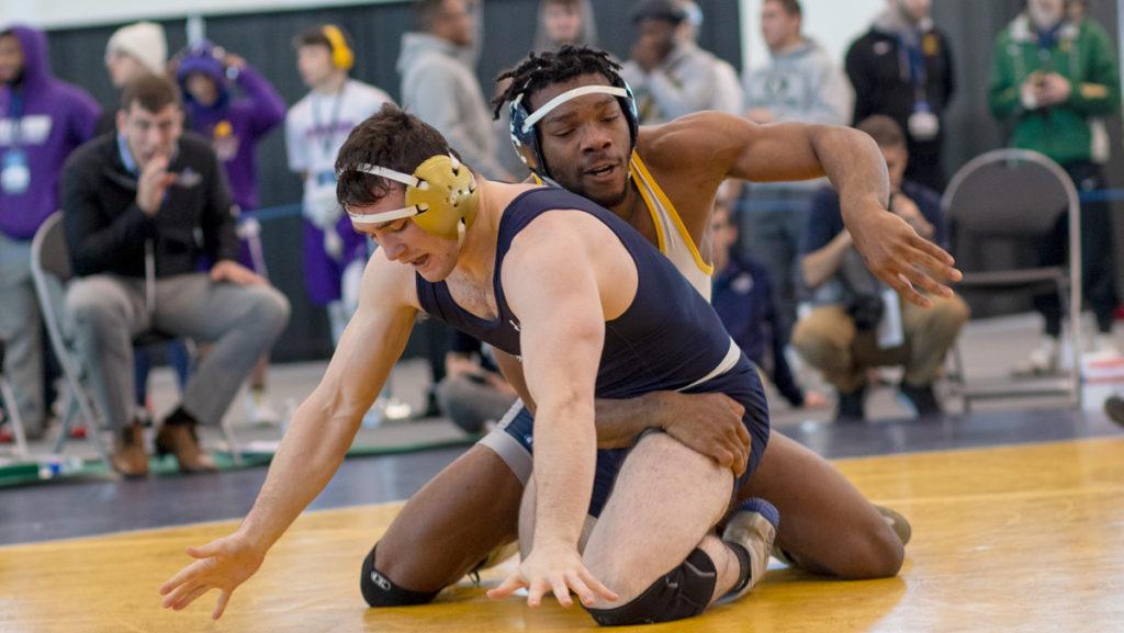 Sophomore+Eze+Chukwuezi+works+to+take+down+his+opponent+in+the+NCAA+Mideast+Regionals+on+March+1.