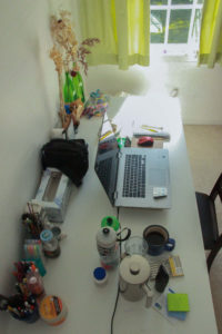 Above view of desk and water bottles