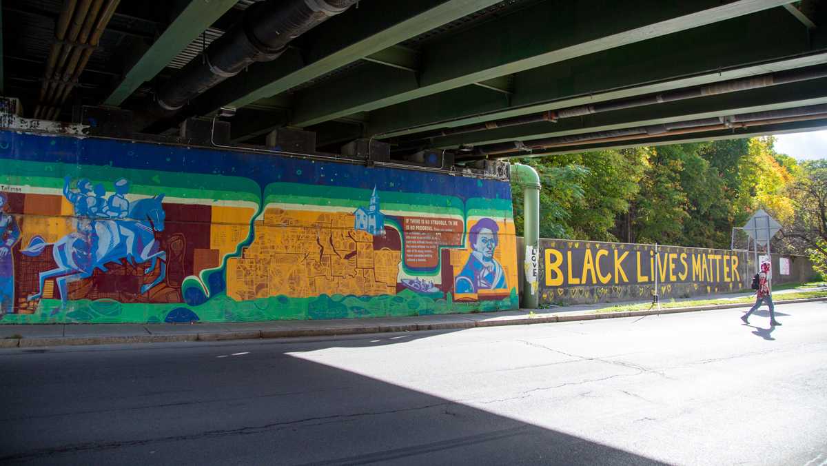 Stories of justice painted into Ithaca murals