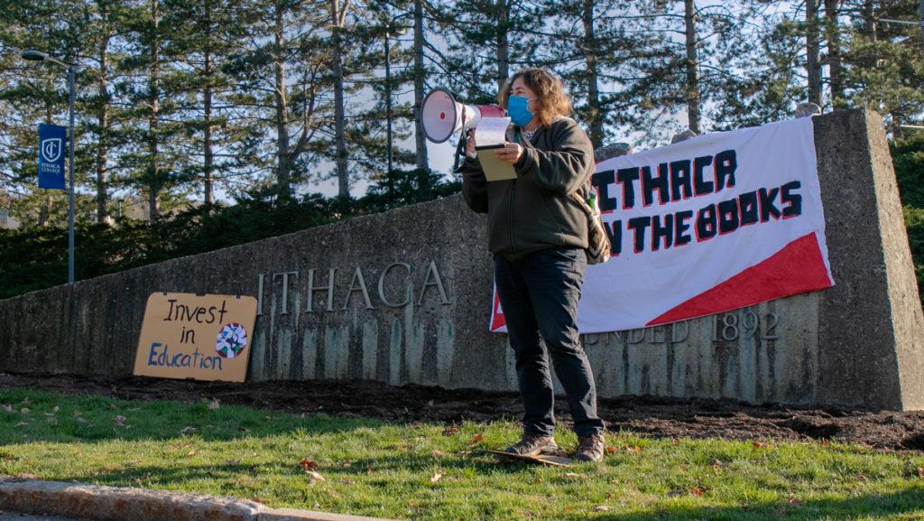 Patricia Rodriguez, associate professor and chair of the Department of Politics, speaks at the Open the Books rally Nov. 14 at the main entrance of Ithaca College.