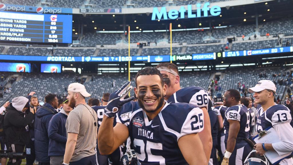 Junior football player Donte Garcia celebrates after Ithaca College defeated SUNY Cortland in the 61st annual Cortaca Jug game Nov. 16, 2019, at Metlife Stadium.
