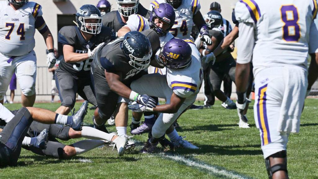Junior Warren Watson tackles an opponent during a game against Alfred University Sept. 21, 2019 at Butterfield Stadium.