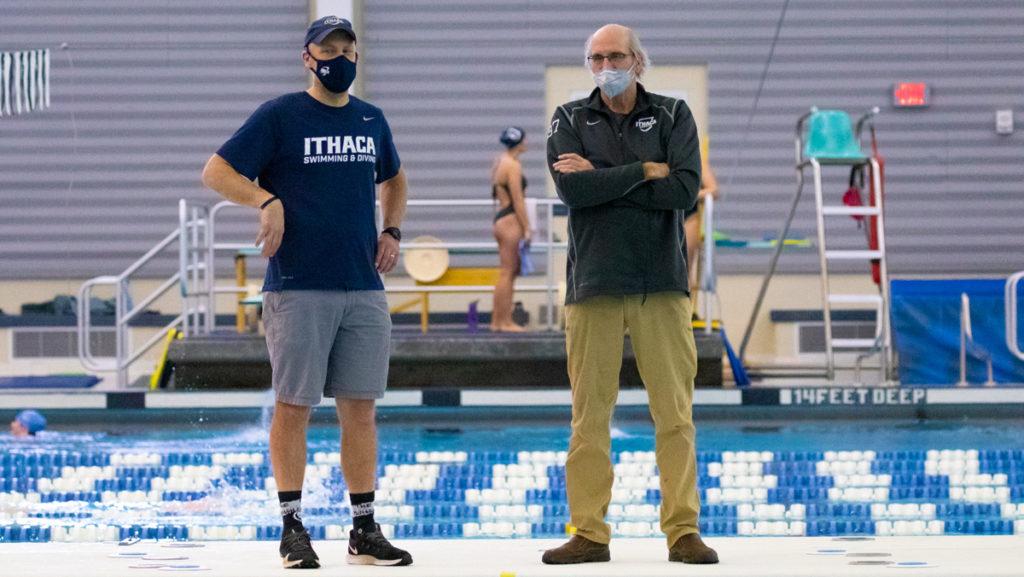From left, Mike Blakely-Armitage, assistant swimming and diving coach, and Kevin Markwardt, head swimming and diving coach, oversee practice Feb. 19.