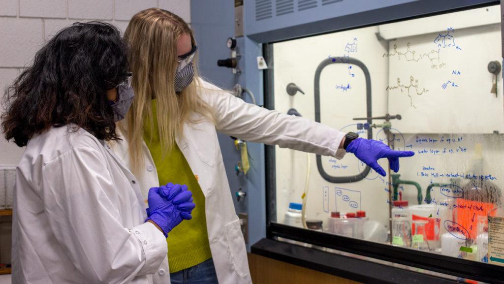 From left, juniors Paige Ramkissoon, president of IC Women in STEM, and Beth Ryan, vice president, work in a Center for Natural Sciences lab April 26. The recently founded IC Women in STEM club aims to highlight women in the fields of science, technology, engineering and mathematics, as well as raise awareness about forms of discrimination, like sexism, that women face in STEM fields