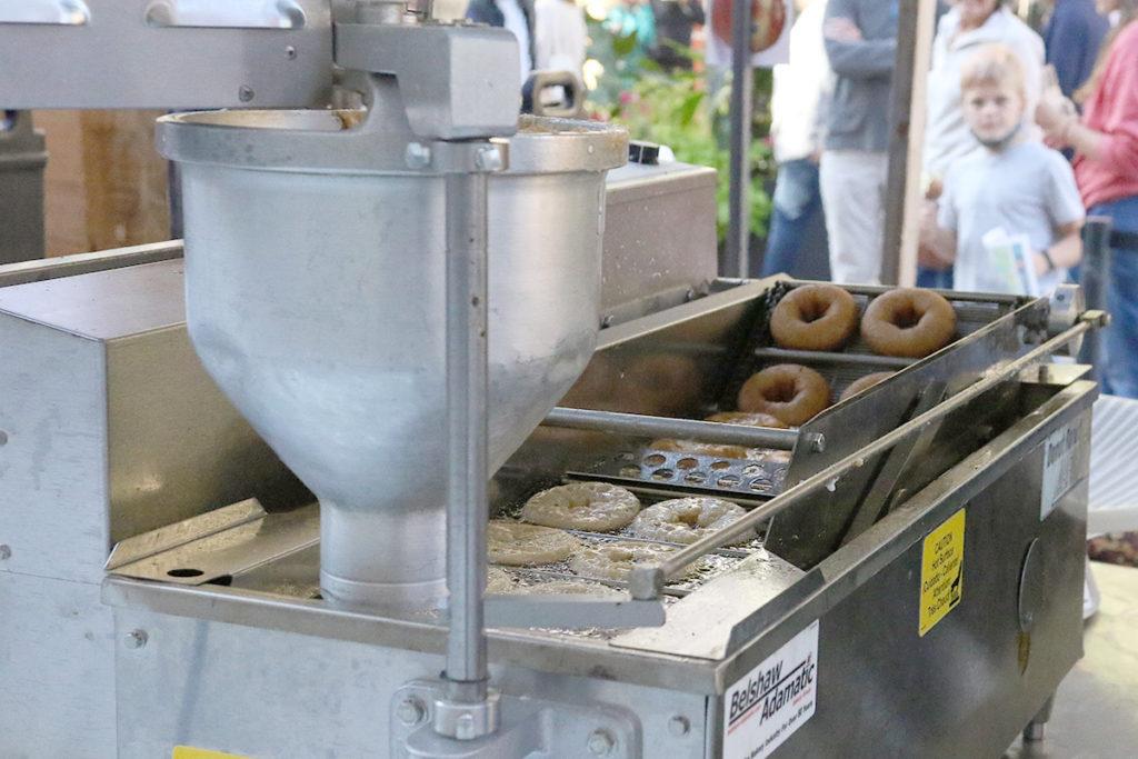 Littletree Orchards has been making and selling apple cider donuts at Apple Fest for approximately 15 years. For their highly anticipated donuts, they use freshly made pear and apple cider in the batter to get the best flavor possible. Malik Clement/The Ithacan