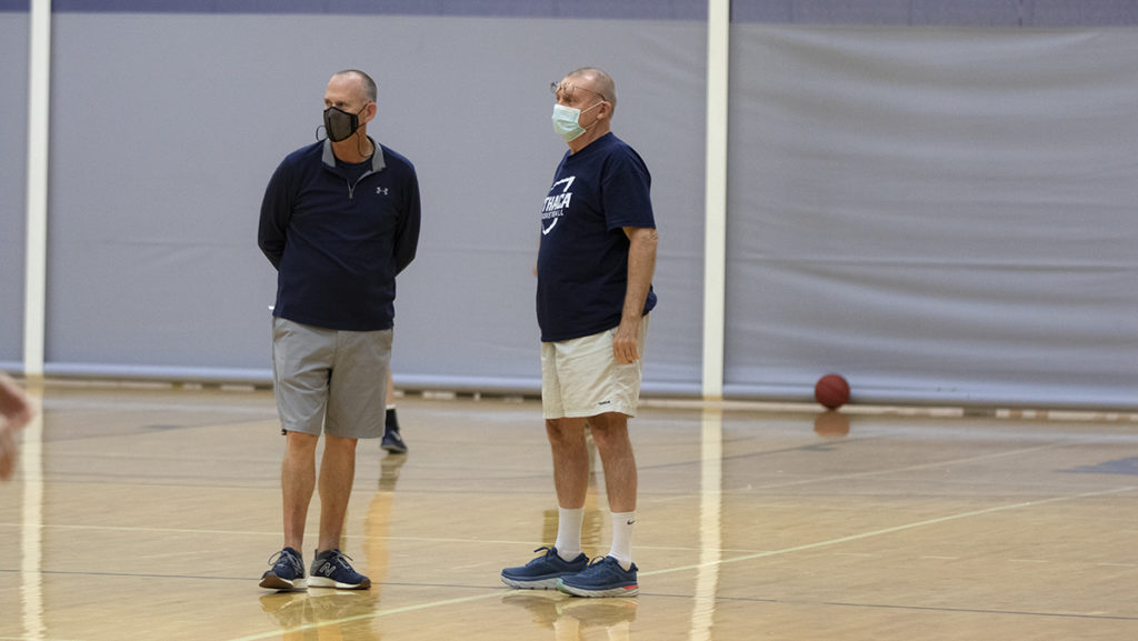 From left, Dan Raymond, head coach of the Ithaca College womens basketball team, and volunteer assistant coach Jim Mullins watch a practice in Mullins first season with the team.