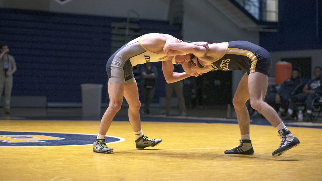 From left, Tito Colom 20 faces a wrestler from Wilkes University Feb. 8, 2019. Ithaca College Athletics is prohibiting spectators at the Ithaca Invitational on Nov. 5 and 6, 2021. 