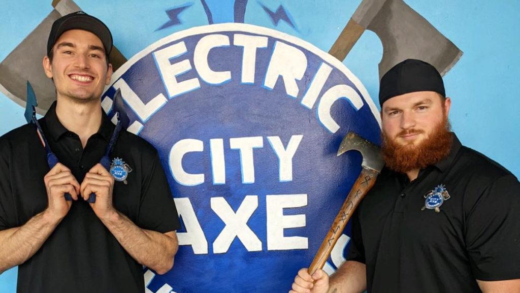Pictured is Senior Sam Williams (left), who is the co-owner of Electric City Axe Throwing, and the first employee of the business and Marine veteran, Chris Ogozaly.
