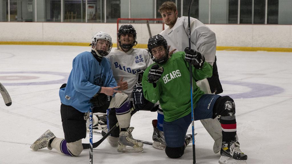 From left, juniors Drew Hyland, Luke Pohlman, Mike Bueti and sophomore Jack Forrestel at the club ice hockey teams practice Feb. 8.