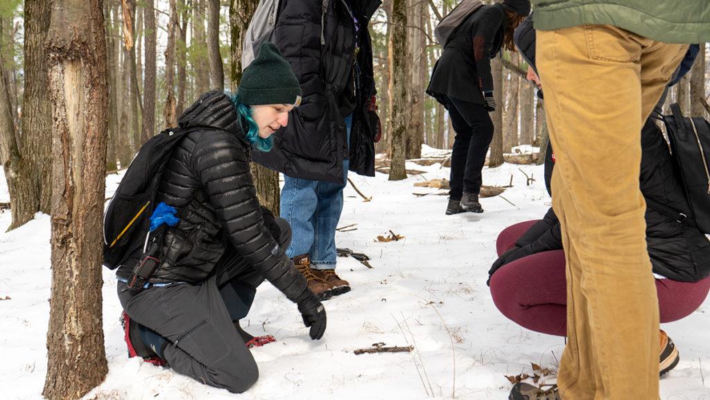 Senior Ana Maria Arroyo, an environmental studies major, leads a wildlife tracking walk Feb. 27 in the Ithaca College Natural Lands. Students were able to spend time outside and learn how to identify the tracks left by local wildlife.