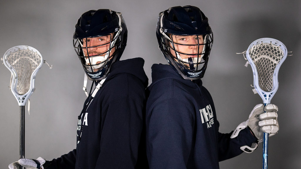From left, senior defenseman Demetri Lowry and sophomore attacker John Sramac of the Ithaca College mens lacrosse team. The team will have a tough slate of conference opponents this season, including reigning Division III champion Rochester Institute of Technology.