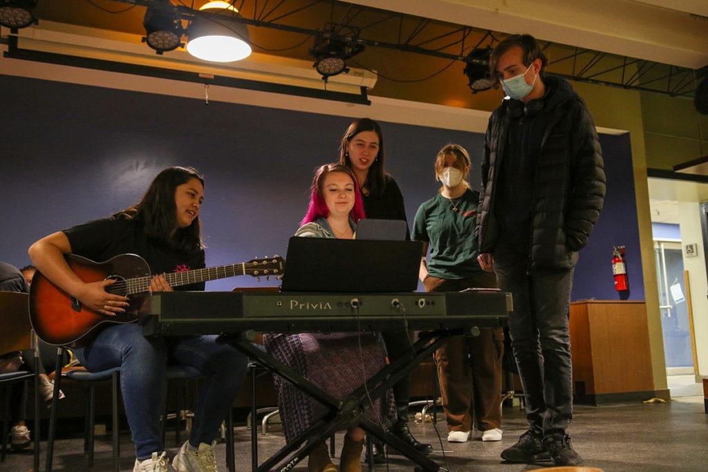 From left, juniors Talia Fontanilla, Allie Lewis, Emma Clinton, freshmen Lily Lipka and Jess Williams from Ithaca College's Tone Cold A capella group perform covers of fun and familiar songs March 21 in IC Square. 