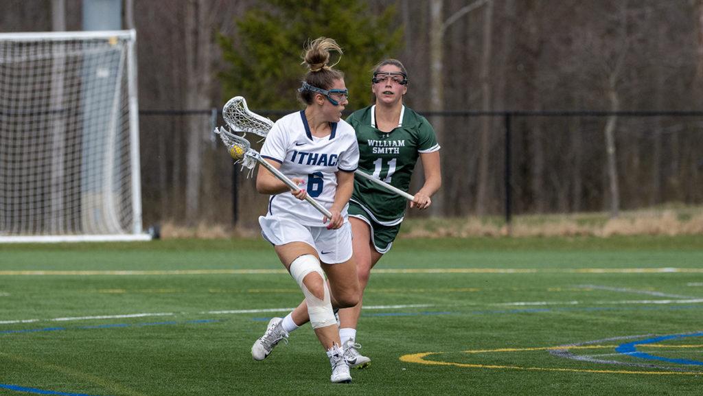 From left, graduate student attacker Alexa Ritchie from Ithaca College looks to avoid senior midfielder Payton McMahon from William Smith. The Herons snuck by the Bombers to stay undefeated in the conference.