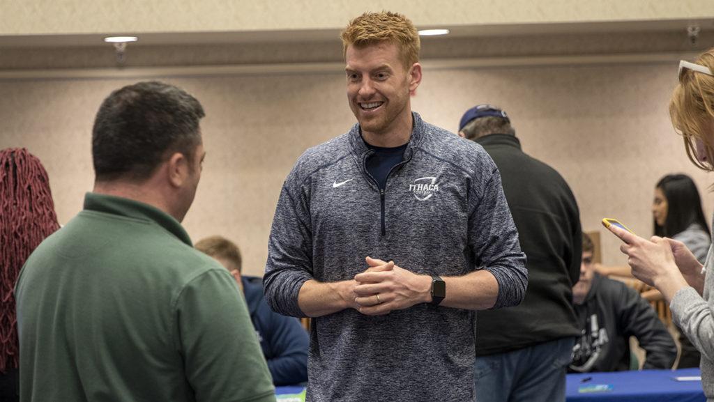 Michael Toerper, head coach of the Ithaca College football team, talks with attendees at the Be The Match event April 22 in the Emerson Suites.
