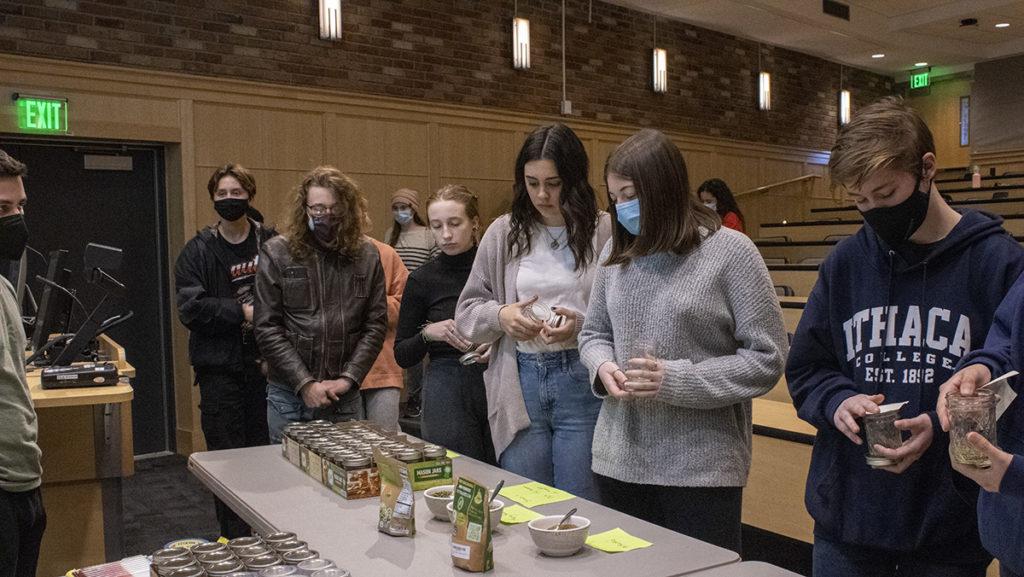 Students line up to create sprout jars with mesh fabric, mason jars and seeds as part of Grow ICs first general meeting as a new on-campus gardening club.