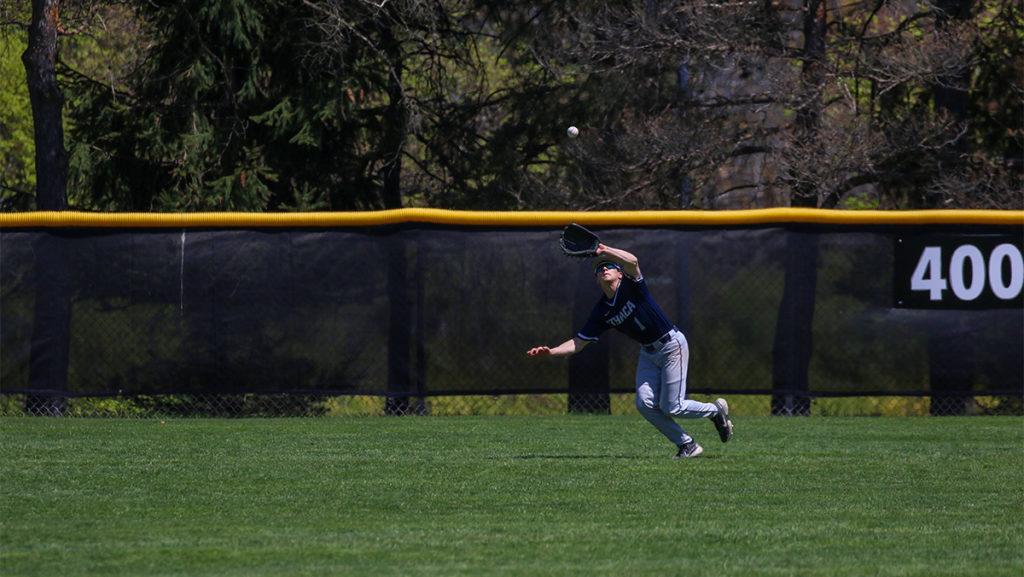 Junior outfielder Mike Nauta makes a catch in center field. The Bombers defeated the University of Rochester 8–7 in 10 innings May 13 to advance to the Liberty League Championship game.