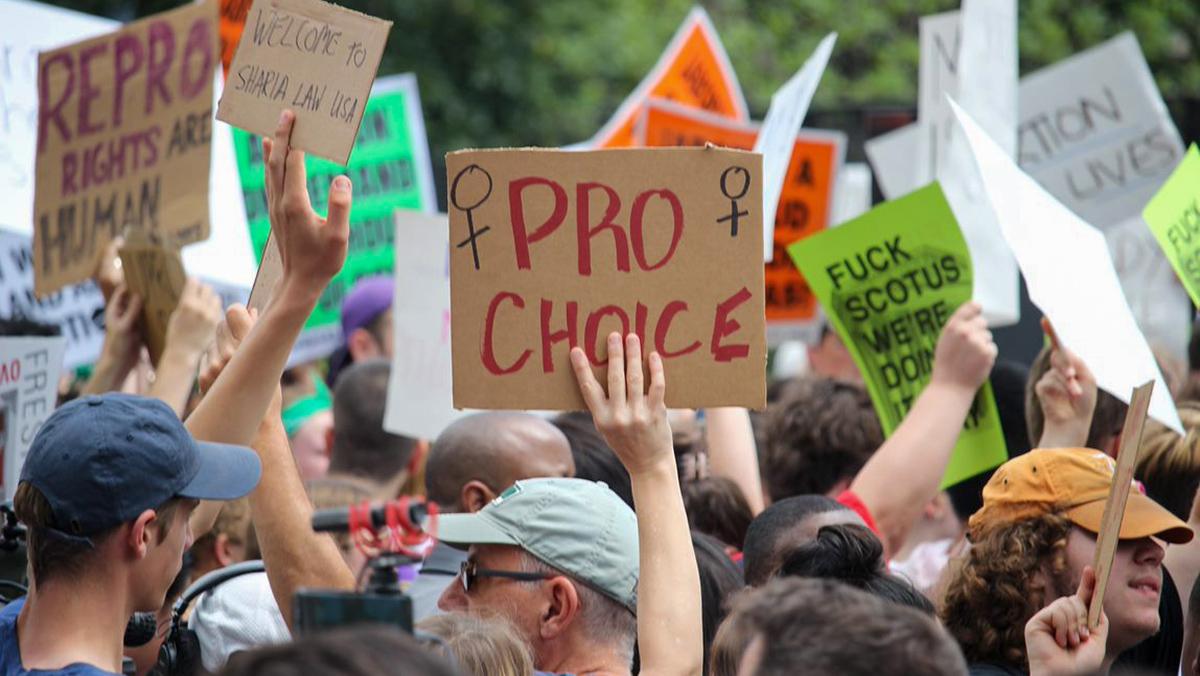 A demonstrator holds a sign labeled “Pro-choice” after Roe v. Wade was overturned this past Friday, June 24. Thomas Kerrigan/The Ithacan