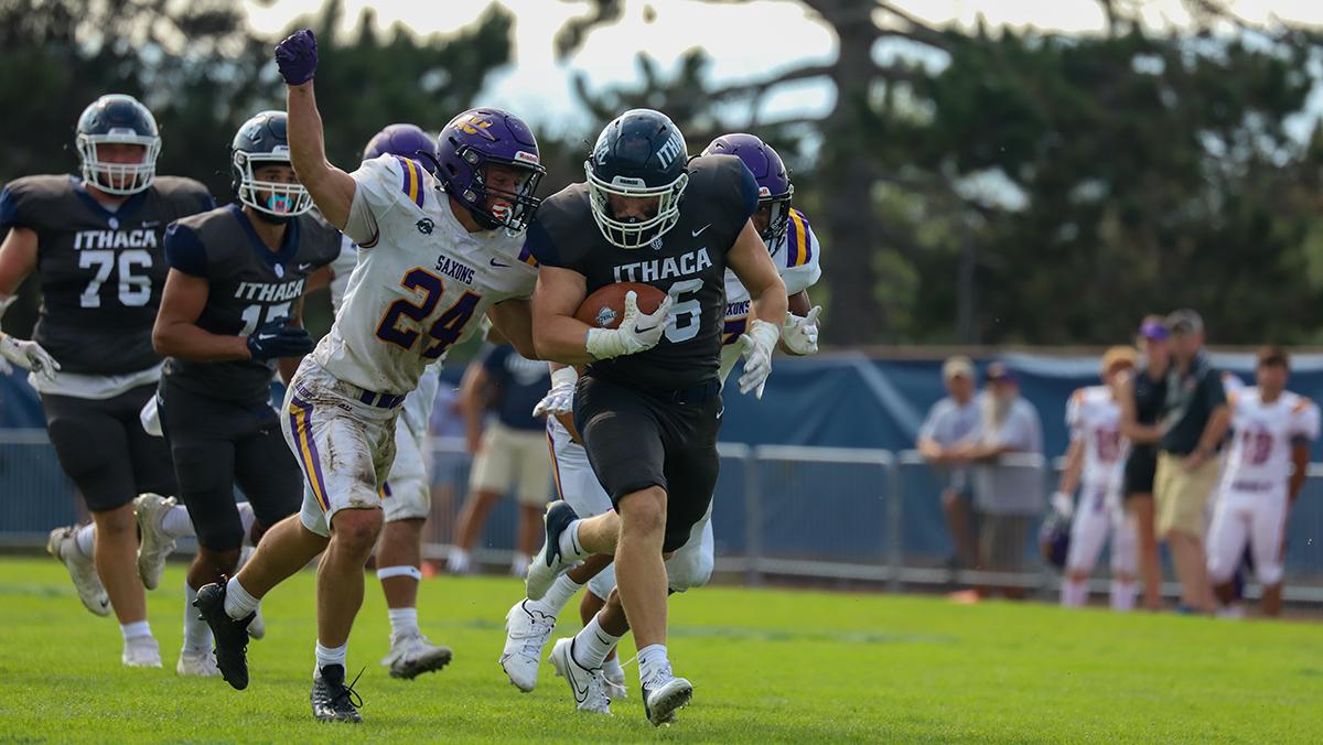 Junior running back Anthony Forbidussi tries to break free from Alfred University sophomore defender Adam Mietz. Nolan Saunders/The Ithacan