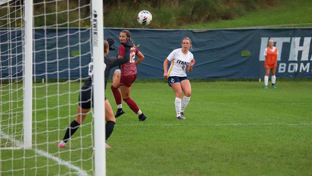 From left, first-year student goalkeeper Avery Byrnes and sophomore defender Grace Wolsieffer of the Cardinals look as senior Bomber forward Delaney Rutan shoots during the Ithaca College womens soccer teams match against St. John Fisher University on Sept. 20.