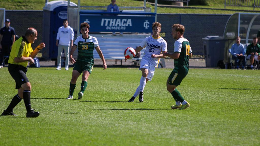 From left, first-year student forward Zach Shufelt, graduate student midfielder Kyle Sicke and sophomore midfielder Josh Conklin chase the ball during the matchup Sept. 24 between Ithaca College and Clarkson University.