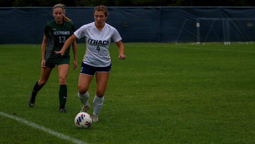 From left, senior defender Katrine Berg of the Herons chases first-year student forward Ava Detorie of the Bombers. The No. 5 ranked Herons won the game 3–0.