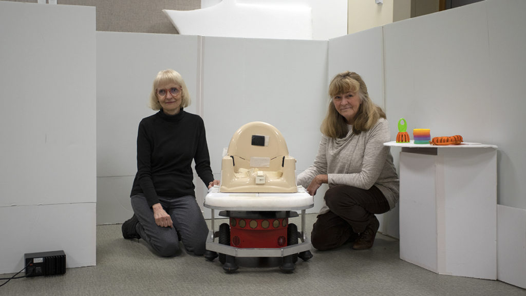 Carole Dennis, a co-founder of Assistance in Motion and professor emerita in the Department of Occupational Therapy, and Sharon Stansfield, the other co-founder and professor in the Department of Computer Science, began research at the college in 2001 to fill the gap they noticed in mobility aids for infants and toddlers with motor impairment.