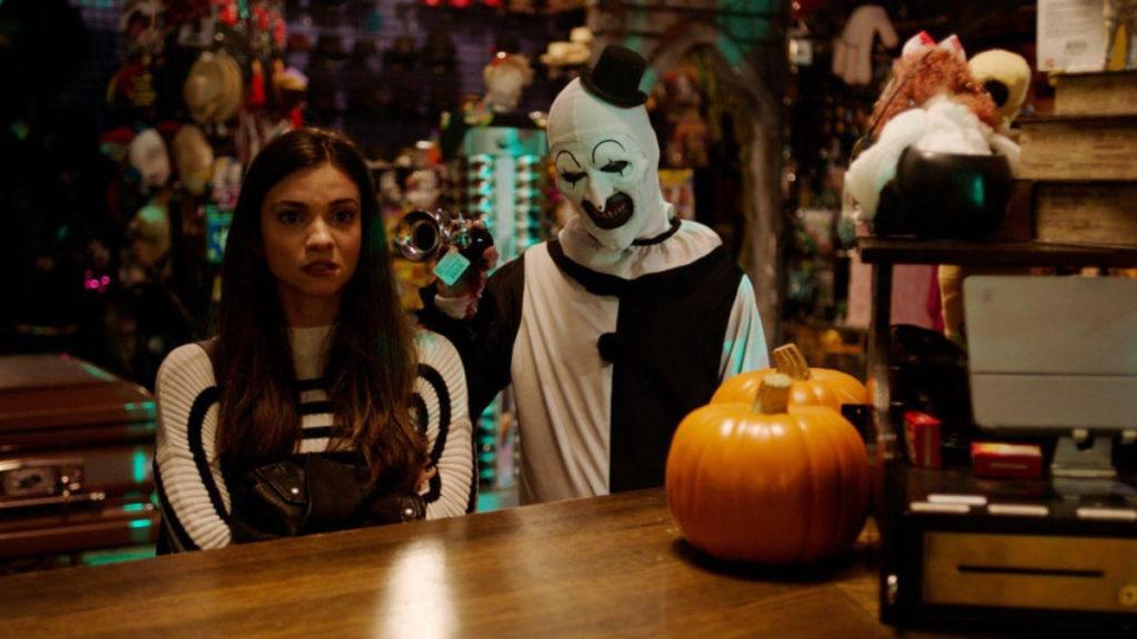 From left, Sienna (Lauren LaVera) is terrorized by Art the Clown (David Howard Thornton), the menacing villain in Terrifier 2.
