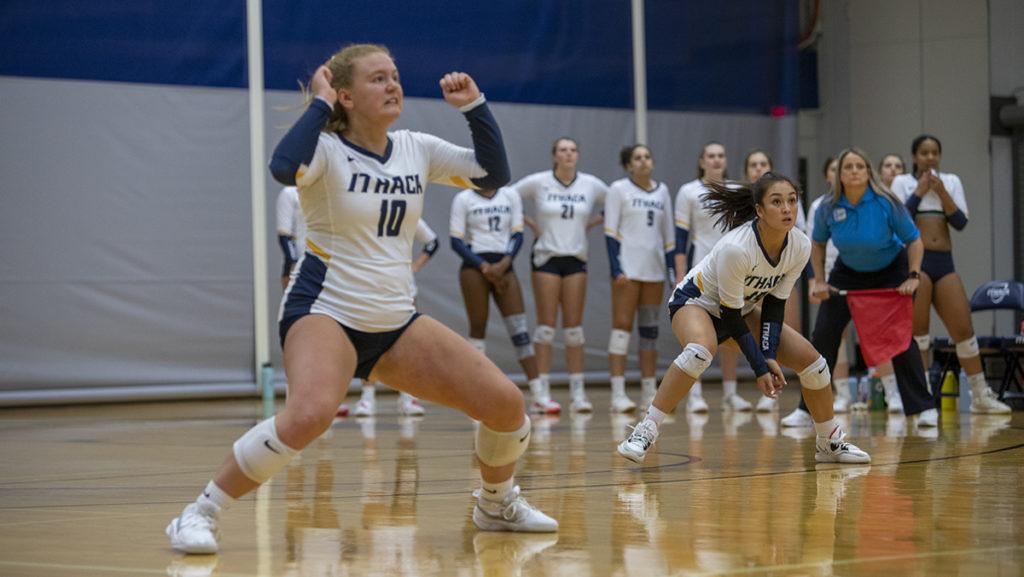 From left, sophomore setter Peyton Miller and first-year student defensive specialist Amanda Zweifler prepare for a shot during the Ithaca College volleyball teams 3–0 win over Vassar College.