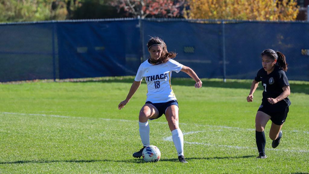 From left, Bombers first-year student defender Ali Amari clears the ball away from RPI sophomore forward Lea Michel.