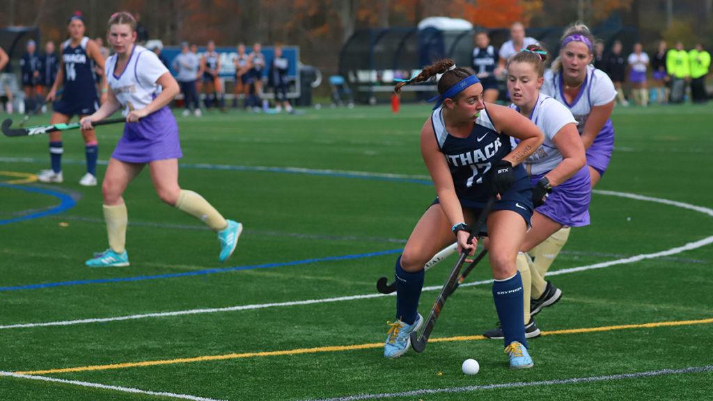 Junior defender Madeleine Goodman brings the ball downfield during the Ithaca College field hockey teams 4–0 defeat of Nazareth College on Oct. 26, 2022. 