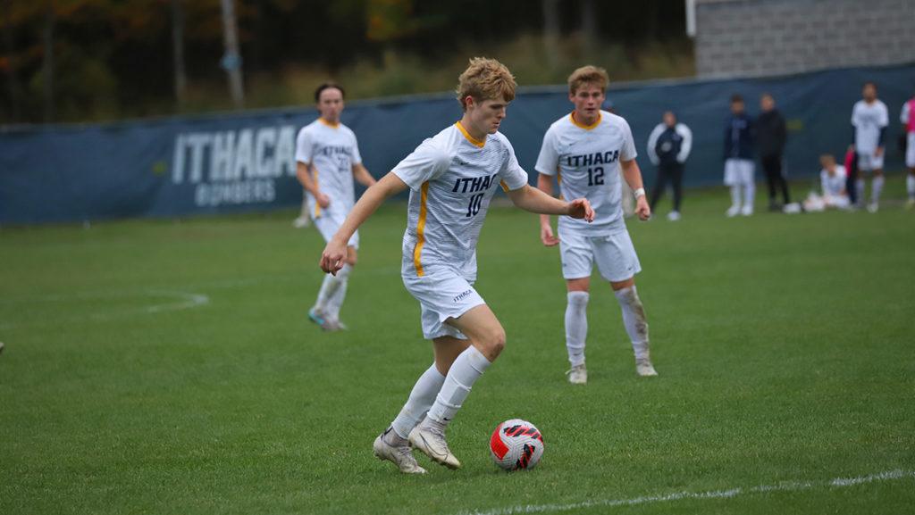From left, junior midfielder Connor Tierney dribbles as midfielder Jack McCarthy 23 watches. The Ithaca College mens soccer team ear
