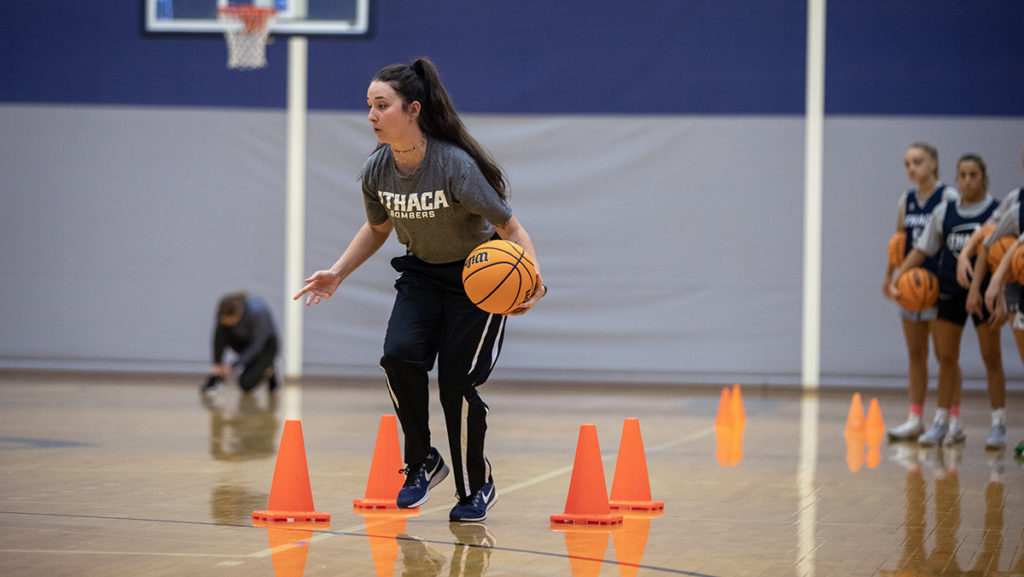Assistant coach Mary Mazzella, who was hired by the college in July 2022, runs a cone drill at the women’s basketball Elite Camp on Oct. 30 in Ben Light Gymnasium to scout potential recruits.