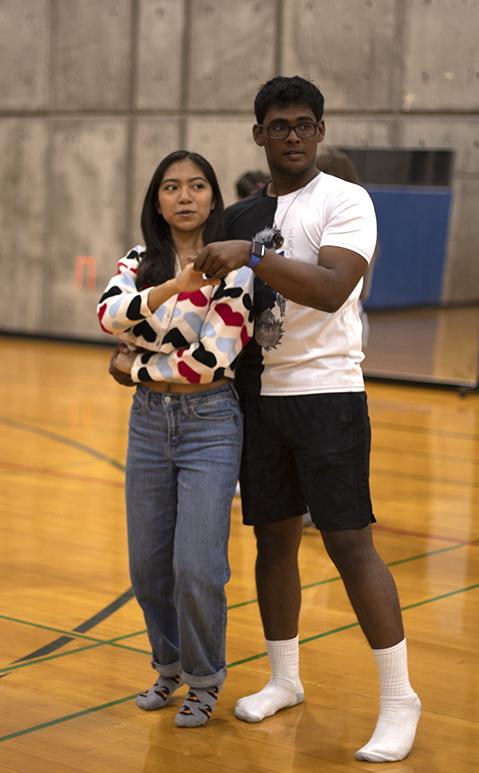 First-year students Samantha Guzman Flores and Ashan Chandrasena practice the steps to the swing together. Maddy Tanzman/The Ithacan
