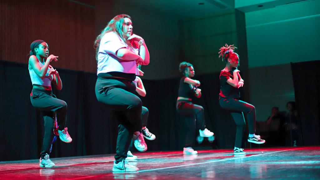From left, seniors Sarah Marshall, Briana Lenna, and sophomores Laura Arias and Khayla Robinson perform a dance routine during the Moving Together charity event for Ballet & Books on Nov. 4.