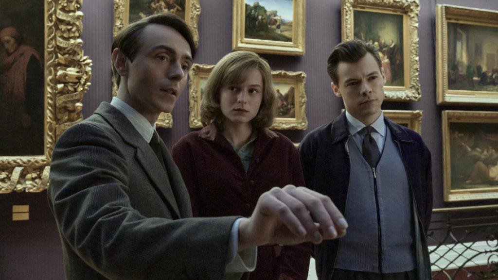 From left, Patrick (David Dawson), Marion (Emma Corrin) and Tom (Harry Styles) find themselves at the center of a story about forbidden love.