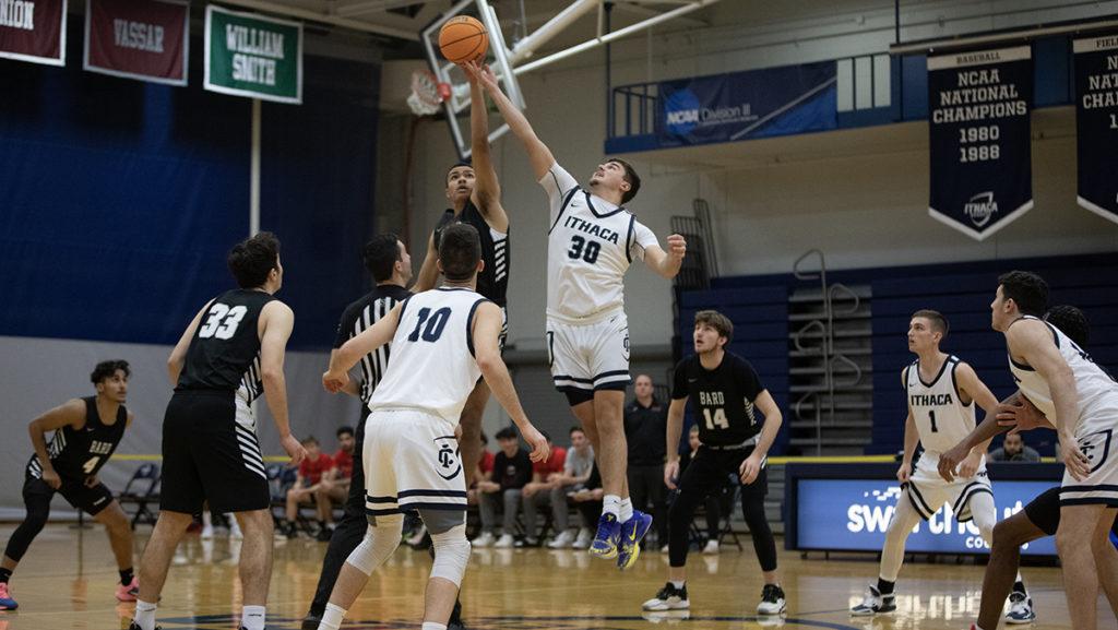 Graduate student forward Luka Radovich aims to secure the tip-off in the Bombers 76–75 victory over Bard College on Dec. 3.