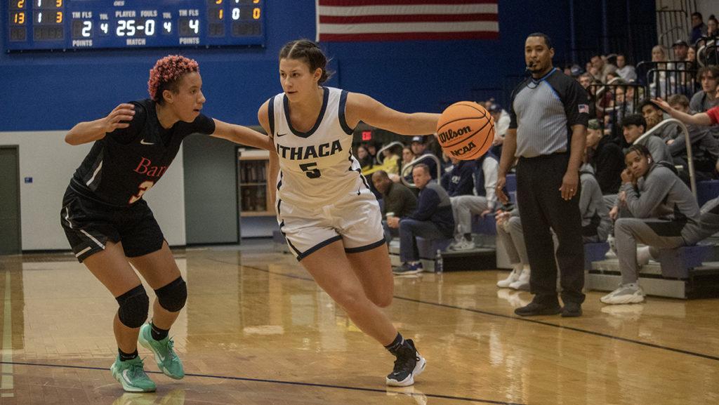 From right, junior guard Graycen Dubin dodges pressure from Raptors junior guard Jade Dinkins during the Ithaca College womens basketball teams game Dec. 3.