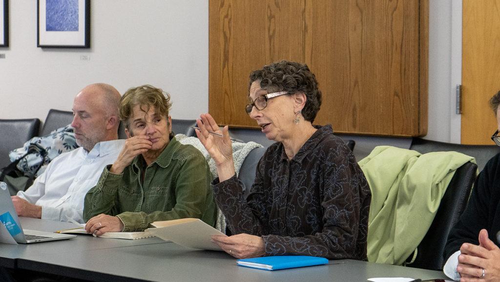 From left, Faculty Council members John Winslow, associate professor in the Department of Physical Therapy; Hilary Greenberger, professor in the Department of Physical Therapy; and Melanie Stein, provost and senior vice president, at the Dec. 6 Faculty Council meeting.