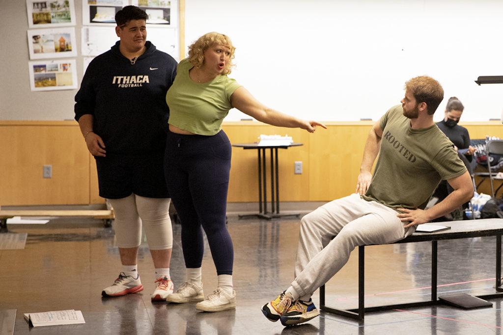 From left, junior Nick Capodilupo, senior Athena Rajnai and junior Nick Jones rehearse for the upcoming performance of The Pirates of Penzance. Grace Vanderveer/The Ithacan