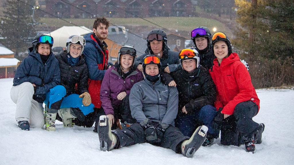 The Ithaca College Ski Racing Club poses for a photo outside the racing lodge at Greek Peak Mountain Resort in Cortland. The team returned from winter break a week early for practice and team bonding.