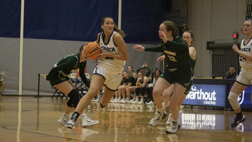 From left, Bombers senior guard Camryn Coffey drives past Thoroughbreds sophomore guard Sarah Chambers.