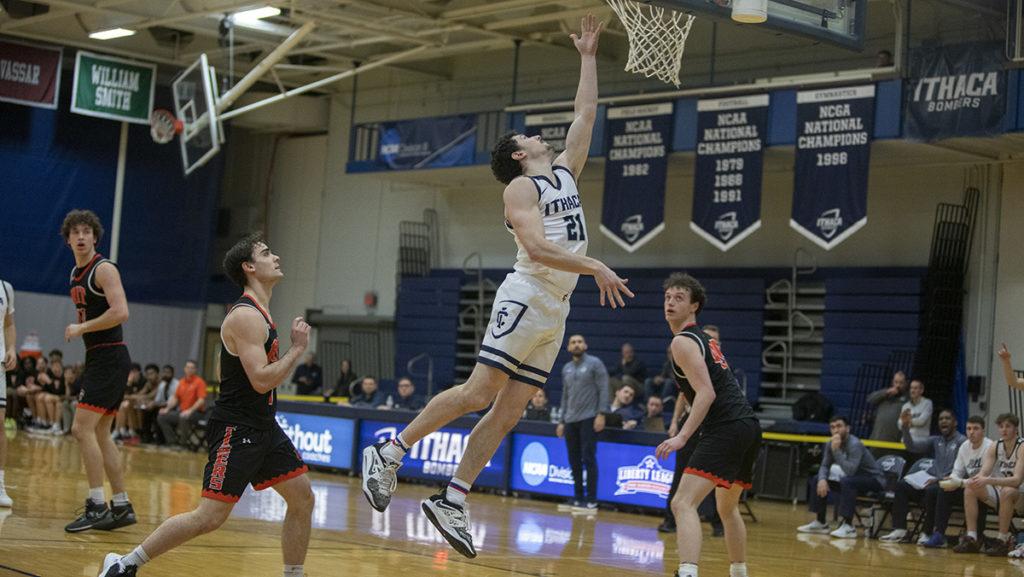Graduate student guard Zach Warech lays in a basket during the Ithaca College mens basketball teams huge win over the Rochester Institute of Technology.
